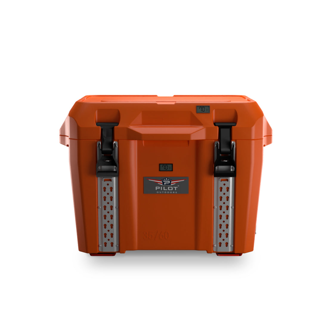Orange hard-shell cooler with black front latches, a molded top handle, and a drain plug at the base.  35/60 Orange Ice Chest Cooler - Pilot Outdoors