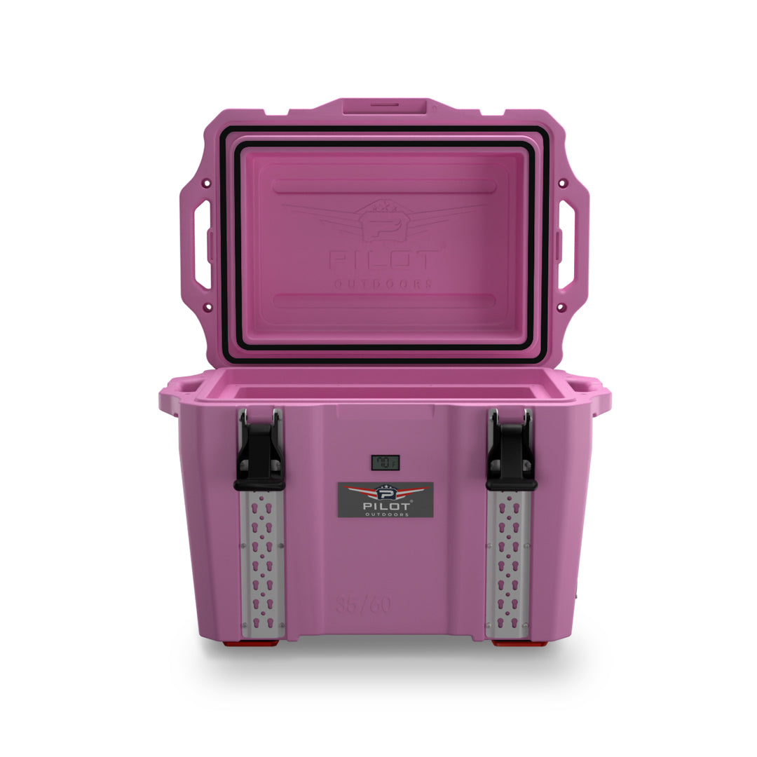 Rectangular pink outdoor cooler with hinged lid and side handles, shown closed against white background.