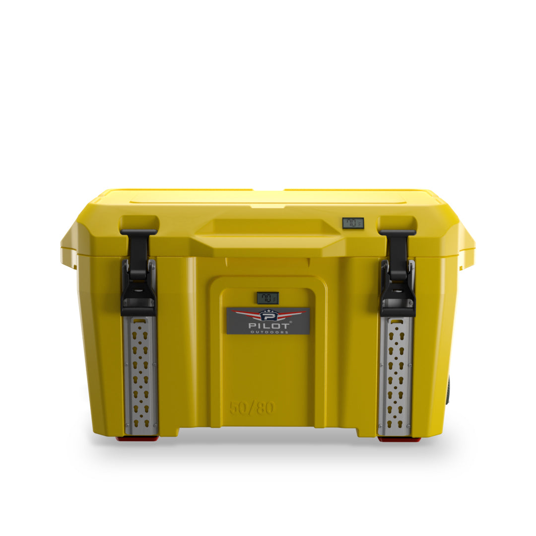 A Yellow Pilot Outdoors premium ice chest cooler with black latches and straps, and red accents.