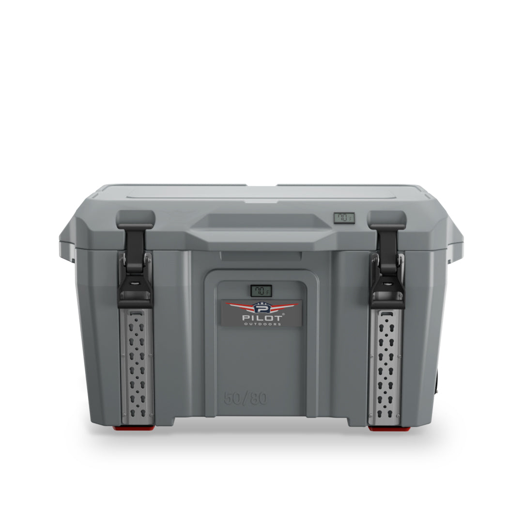 Gray outdoor cooler with sturdy latches, top and side handles, and a front drain plug.
