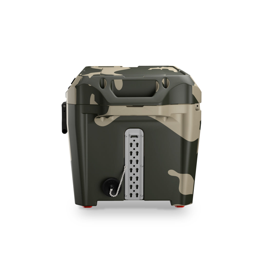 PILOT OUTDOORS Camo-patterned hard cooler chest with open lid showing insulated interior, branded ‘Pilot Outdoors’.